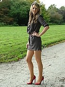 Red high heels and shiny pantyhose always look good in the outdoor sunshine