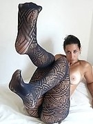 Hot latin girl in patterned pantyhose