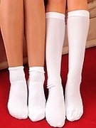 Cute lesbian girls in their tiny hooters uniform and pantyhose