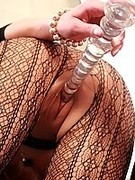 Sexy fashion fishnet leggins over pantyhose and glass dildo in pink cunt
