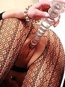 Sexy fashion fishnet leggins over pantyhose and glass dildo in pink cunt