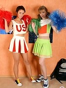 Sporty cheerleaders pleasing each other without taking off their pantyhose